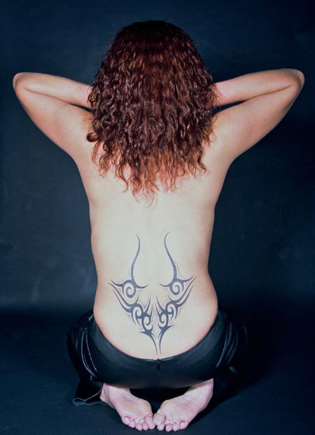 tribal-horns-lower-back-tattoo